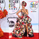 Illustration for article titled Statement Suits, Plush Pinks, and a Lotta Gowns on the American Music Awards Red Carpet